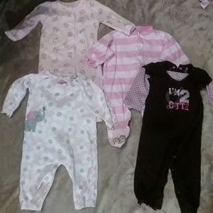 Baby one piece jumpsuits and pjs.